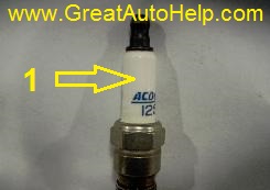 Cracked spark plug will cause misfire code P0300 and an engine that idles rough