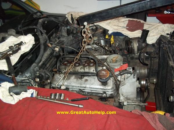 Ford 5.0L Mustang engine removal using hoist.